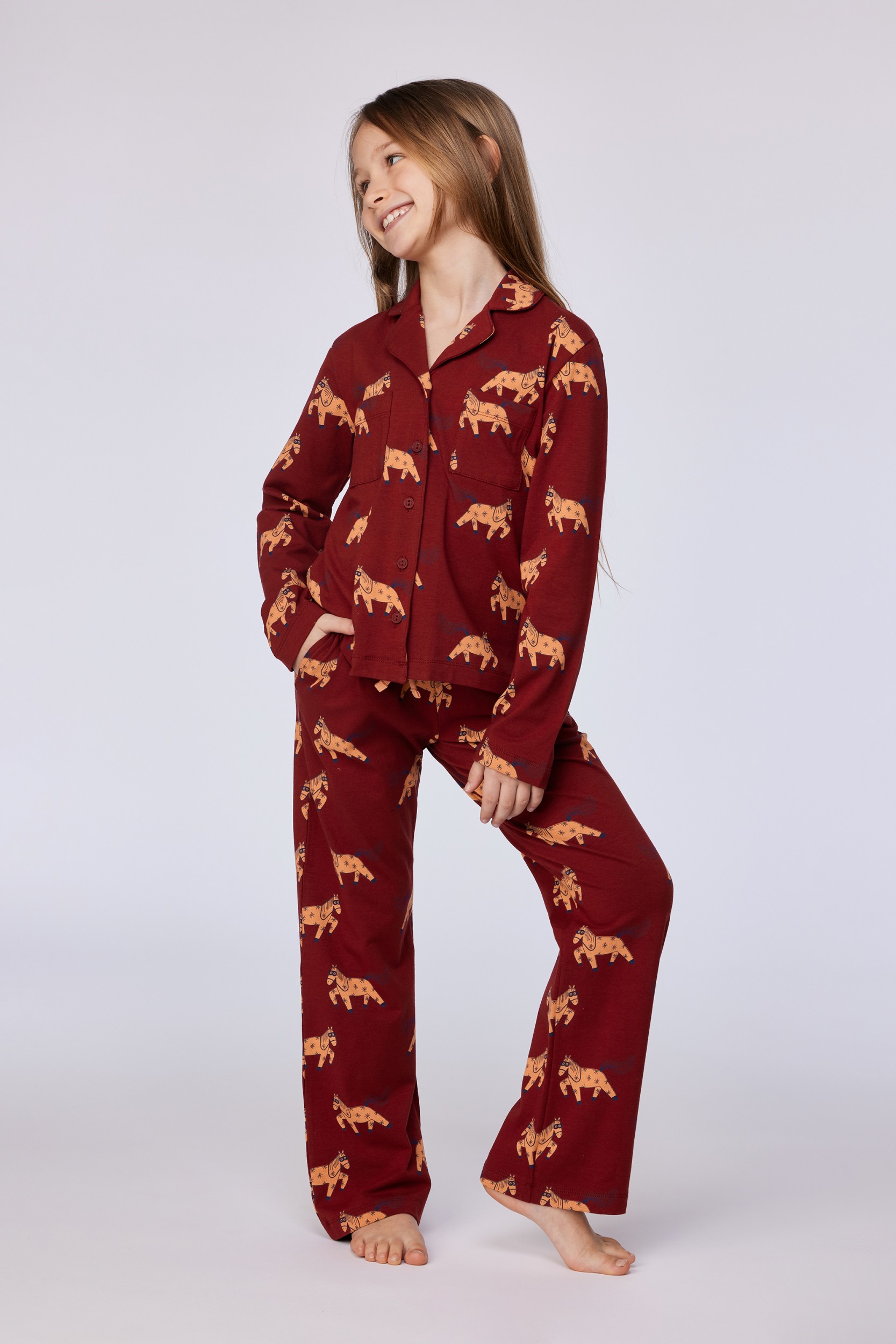 Donkerrode pyjama met ponyprint in rekbaar katoen