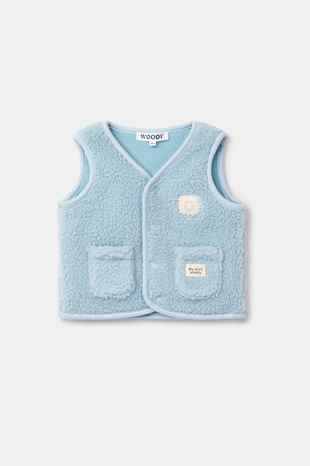 Lichtblauwe bodywarmer van zachte teddystof
